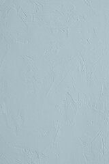 Pastel light blue colored low contrast Concrete textured background. Empty colourful wall texture with copy space for text overlay and mockups. 2023, 2024 color trend