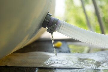 Blue plastic hose for cleaning a swimming pool, Close-up
