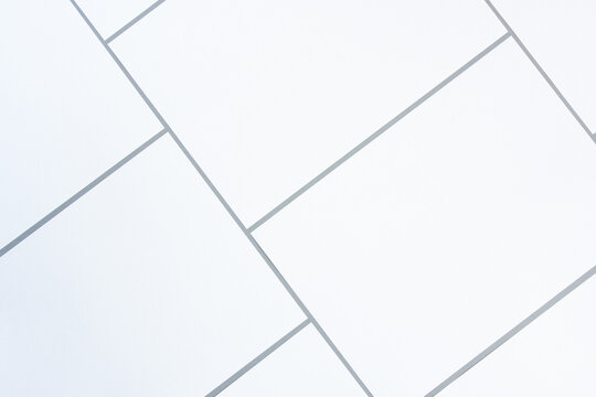 Empty white rectangle poster mockups on a gray background