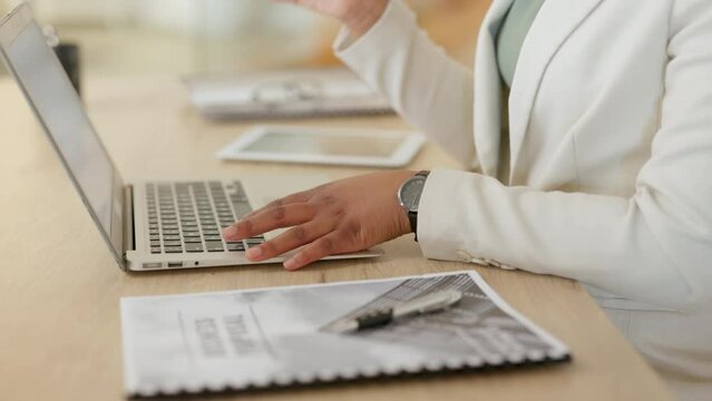 A female lawyer working on a case for a client in her office. Closeup of a business woman typing a financial proposal at her workplace. Entrepreneur using a laptop to compile an insurance document