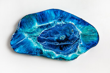 Handmade epoxy resin product: a stand for jewelry in the form of a blue sea with waves