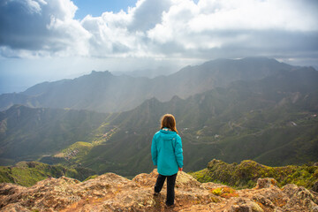 Sporty woman hiking in Anaga Mountains Taganana Tenerife, Canary island resort