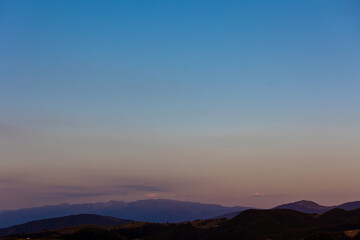 Fototapeta na wymiar Beautiful sunset landscape with mountains