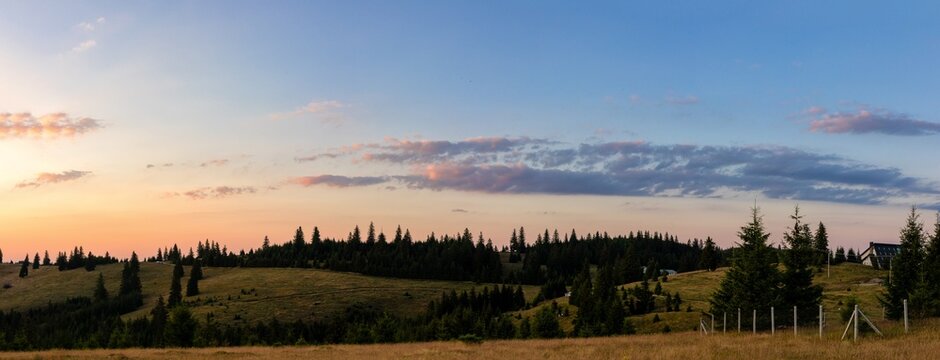 Beautiful sunset landscape with mountains and trees - panorama © Mihai Zaharia