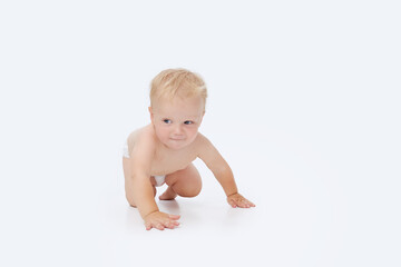 Cute little baby in a diaper on a white isolated background