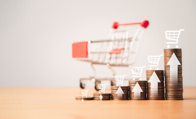 Increasing coins stacking with up arrow and drawing and actual trolley cart for business sale...