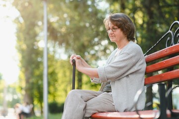 Portrait of a happy Senior woman in summer park