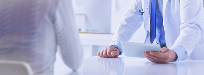 Doctor man with patient in medical office