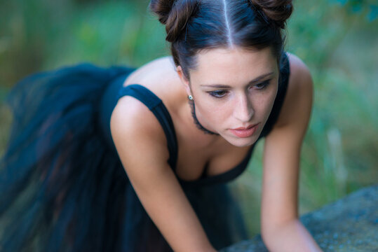Beautiful goth ballerina in the summer nature