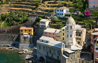 Fototapeta na wymiar Travel to Cinque Terre. Aerial view over Vernazza architecture landmark village at the coast of Liguria Sea from Italy. 