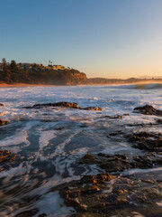 Ocean water flowing into the rocky shore.