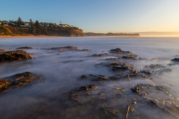 Long exposure view of Warriewood Beach in the morning, Sydney, Australia.