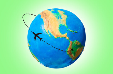Global transportation. Planet Earth with a silhouette of an airplane flying along the route. Green background. The concept of air travel