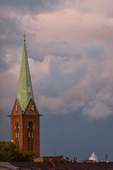 A view to the St. Gertrude's New Church tower in Riga on an overcast day with dramatic clouds Nr.1