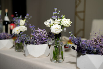Banquet table. Tableware. Food, snacks, fruit, drinks, chairs, table, table decoration, flowers