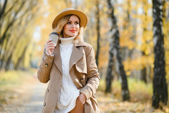 Beautiful Woman In Autumnal Park.