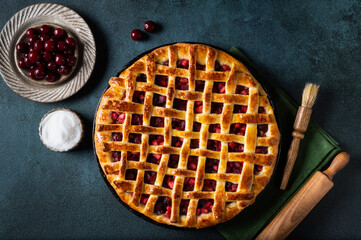 Piece of Cherry Pie with a Flaky Crust on dark background. Top view. American pie. Cherry dessert. Flatlay. Cherry filling