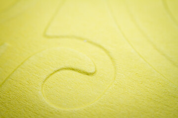 Extreme macro of embossed yellow paper
