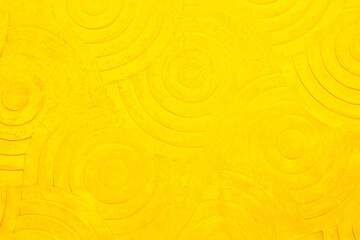 Yellow concrete texture wall background. Abstract orange paint floor stamped concrete surface.