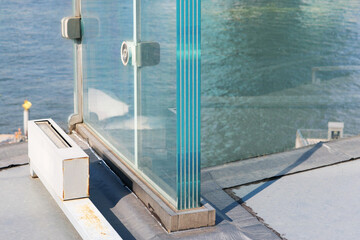 Naklejka premium Resistant laminated glass structure special thickness layer installed on aluminium frame. 