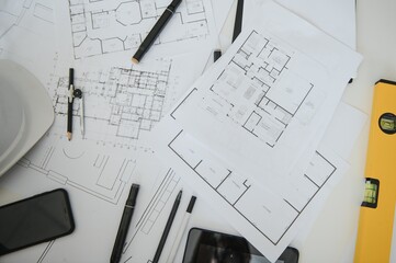 Naklejka na ściany i meble architect design working drawing sketch plans blueprints and making architectural construction model in architect studio,flat lay.
