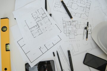 Naklejka na ściany i meble architect design working drawing sketch plans blueprints and making architectural construction model in architect studio,flat lay.