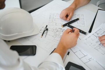 Team of architects people in group on construciton site check documents and business workflow