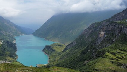 Naklejka na ściany i meble Reservoir in Austrian Mountains - Ariel Drone Shot