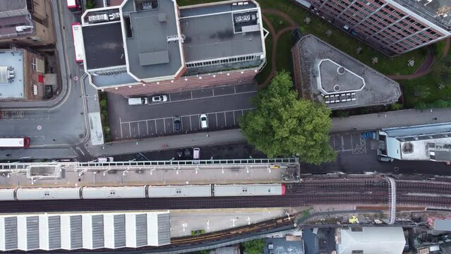 Drone static shot of a top view of the Putney Bridge station platform.