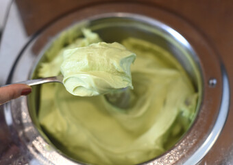 Avocado ice cream in a mixer closeup 