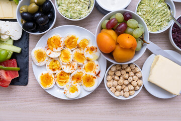 Healthy breakfast concept with fresh vegetables, eggs, nuts and fruits