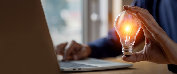 Close up hand choose light bulb or lamp with bright for human resources or leadership and creativity thinking idea motivation or vision and knowledge learning.