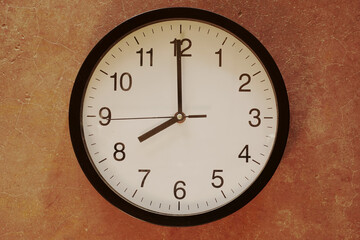 Fototapeta na wymiar Classic black and white analog clock blue background