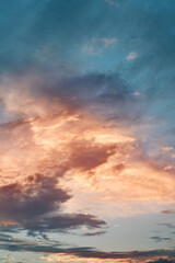 Beautiful colorful summer sky after sunset or before sunrise. Glowing vibrant cloudscape in the evening