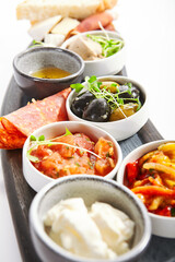 Wooden tray with snacks close up view
