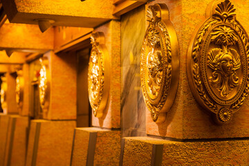 Antique room with a wall, with ancient gold plates on the walls.