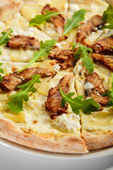 Pizza with eel, pear and cheese sauce