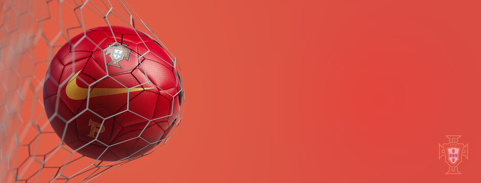 Guilherand-Granges, France - July 25, 2022. National football team of Portugal. Soccer ball in net with official logo of the Portuguese Football Federation. 3D rendering.