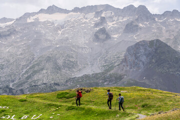 Obraz premium walking in front of the Maladeta massif, route to France through the Portillon pass, Benasque Valley, Huesca, Pyrenean mountain range, Spain