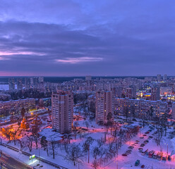 Night view of residential multi-storey houses in a residential area of ​​Kyiv, Ukraine in winter