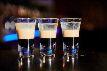 A set of shots b-52 from coffee liqueur, Irish cream and orange liqueur