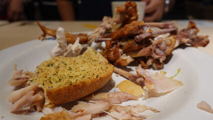 Empty plate with leftover food after a meal, representing dining finished, food waste concept, and casual eating lifestyle.