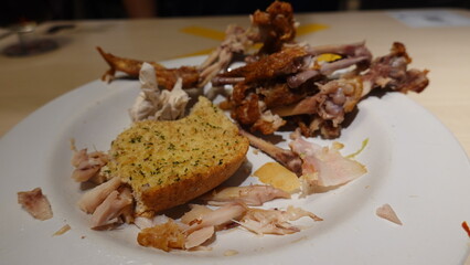 Empty plate with leftover food after a meal, representing dining finished, food waste concept, and casual eating lifestyle.