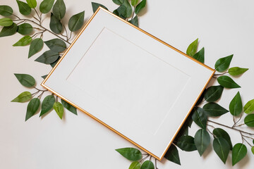 Mock up poster. Minimal template with empty picture frame mock up. White background with plants