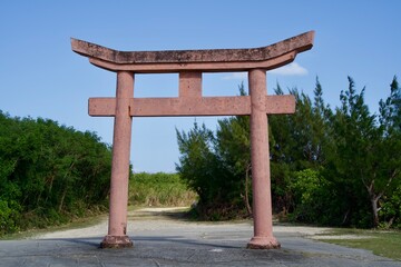Torii gate with blackened and faded upper part