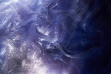 Obraz na płótnie Canvas Liquid fluid art abstract background. Blue acrylic paint underwater, galactic smoke ocean