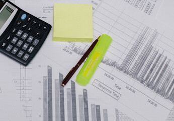 Calculator, pen, graph, white background