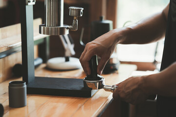 Barista cafe making coffee with manual lever espresso machine preparation service concept in...