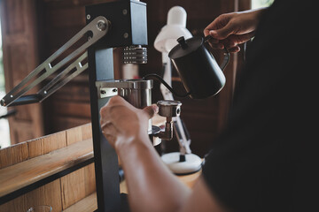 Barista cafe making coffee with manual lever espresso machine preparation service concept in...