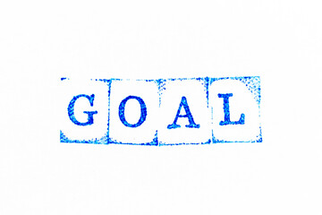 Blue color ink rubber stamp in word goal on white paper background
